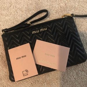 Miu Miu Black metalasse wristlet , new with cards